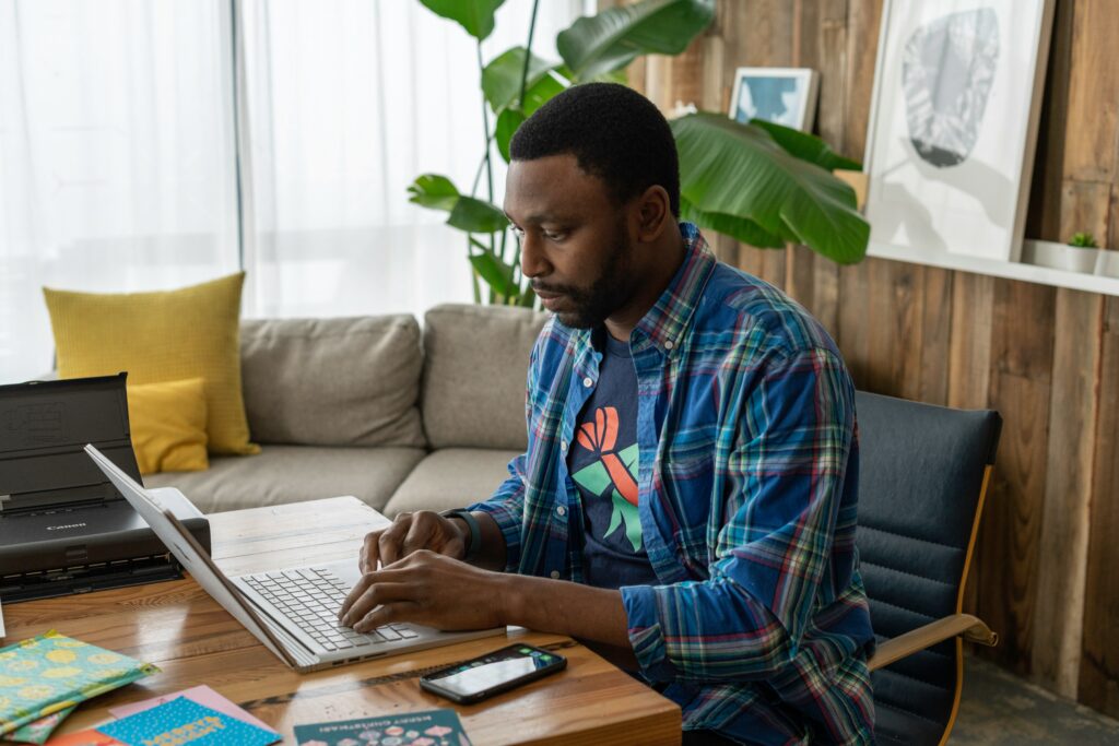 A businessman working in an office at a laptop