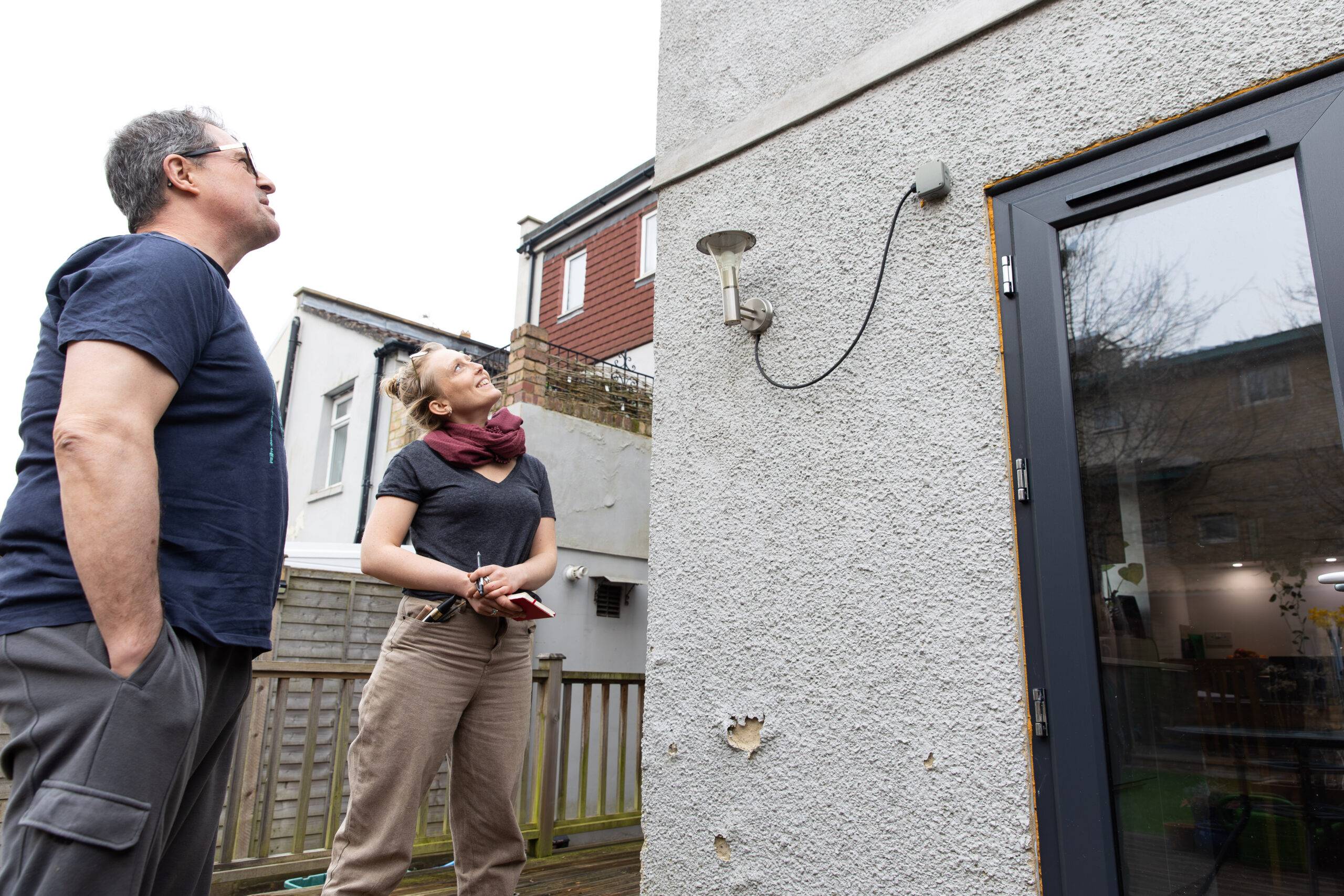 Clara From Retrofit West chats with a homeowner about what measures they might want to make at their home. March 2025.