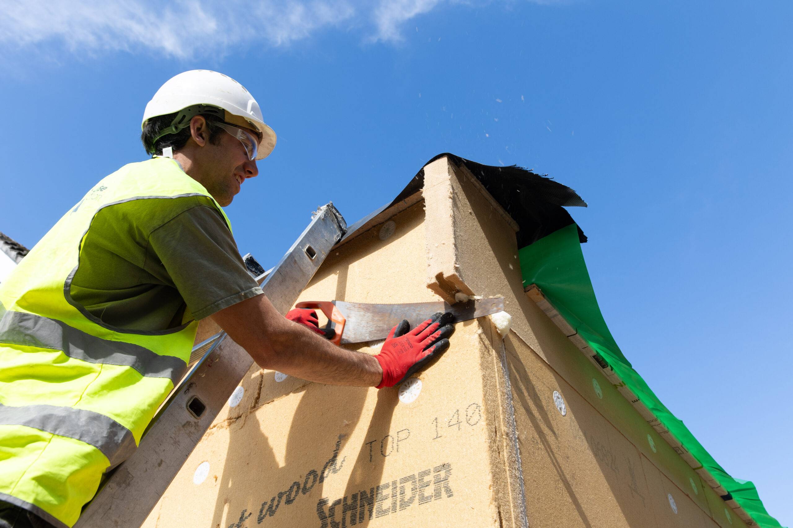 Person installing insulation
